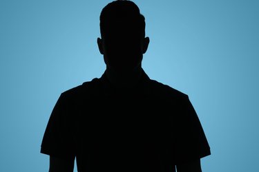 Silhouette of man on bluebackground