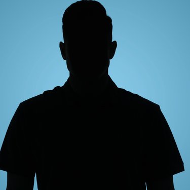 Silhouette of man on bluebackground