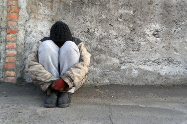 Person sat with head down