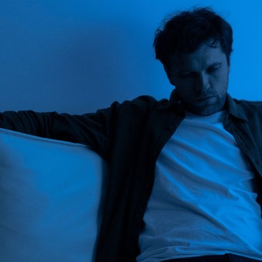 Man sat on sofa