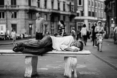 Man lying on bench