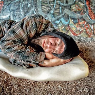 Homeless man on floor