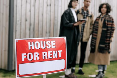 Houses for rent sign with renters