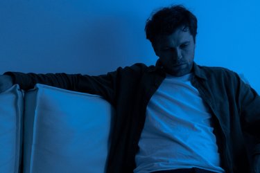 Man sat on sofa